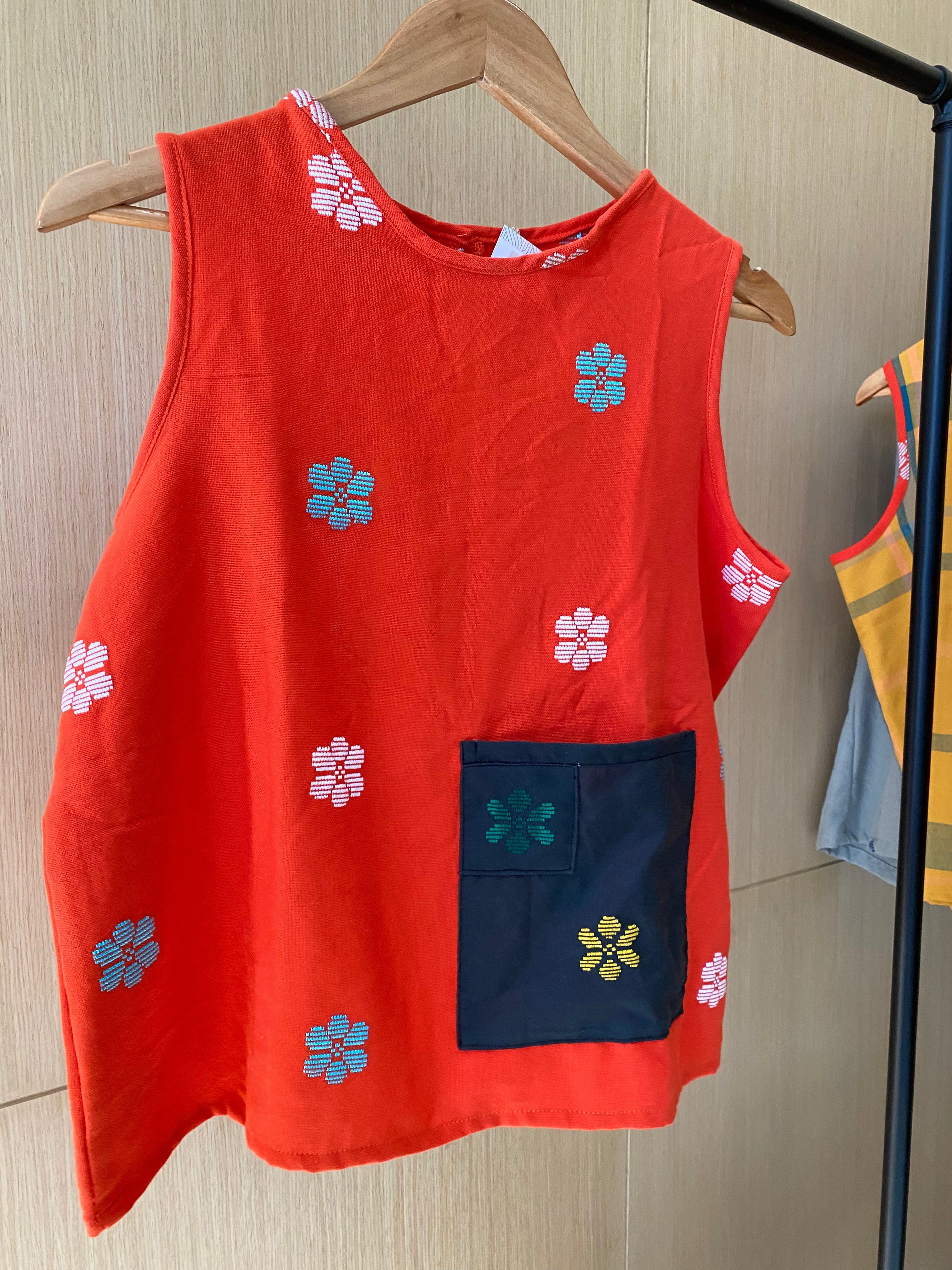 SLEEVELESS:  ORANGE FLOWERS W/ BLACK POCKET