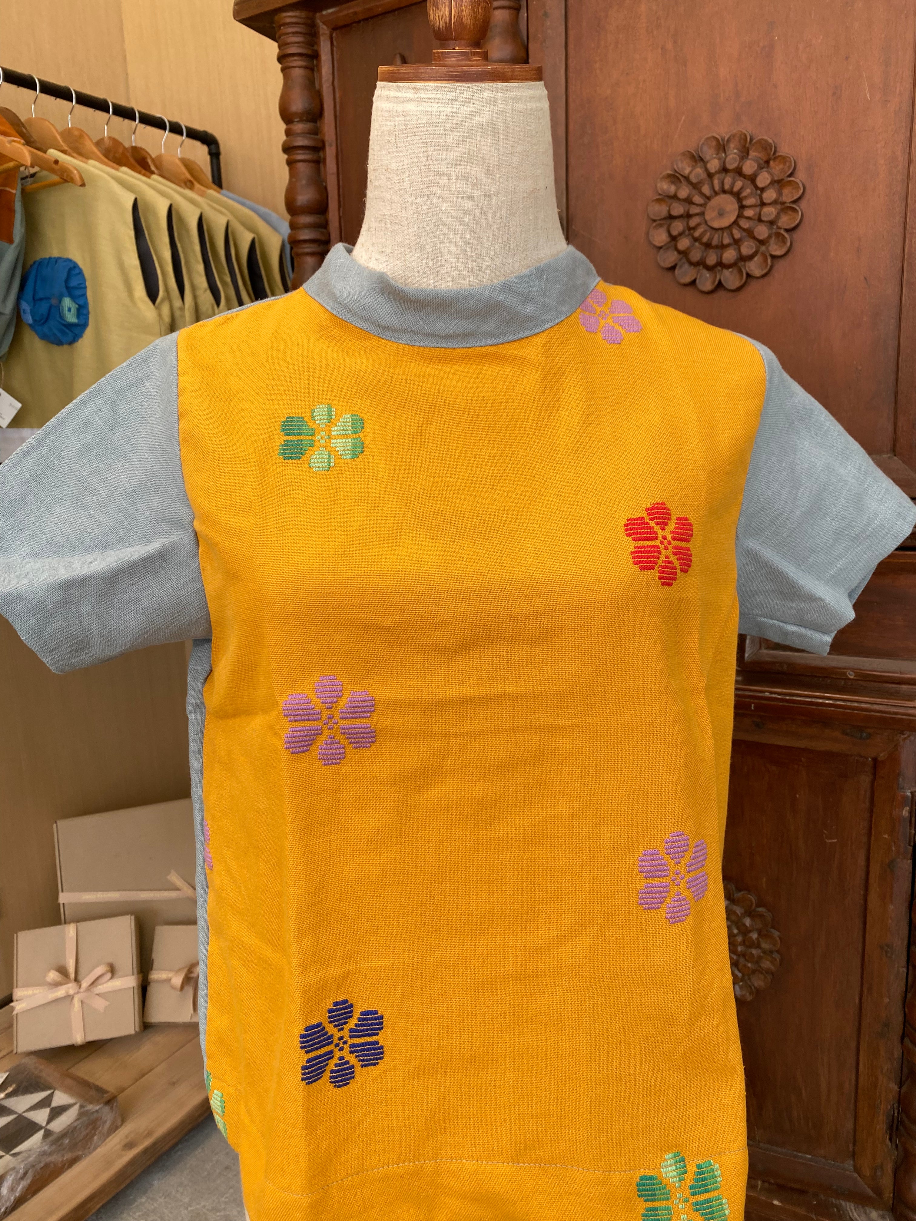 Pamana: Sunny Yellow flowers w/ grayish linen