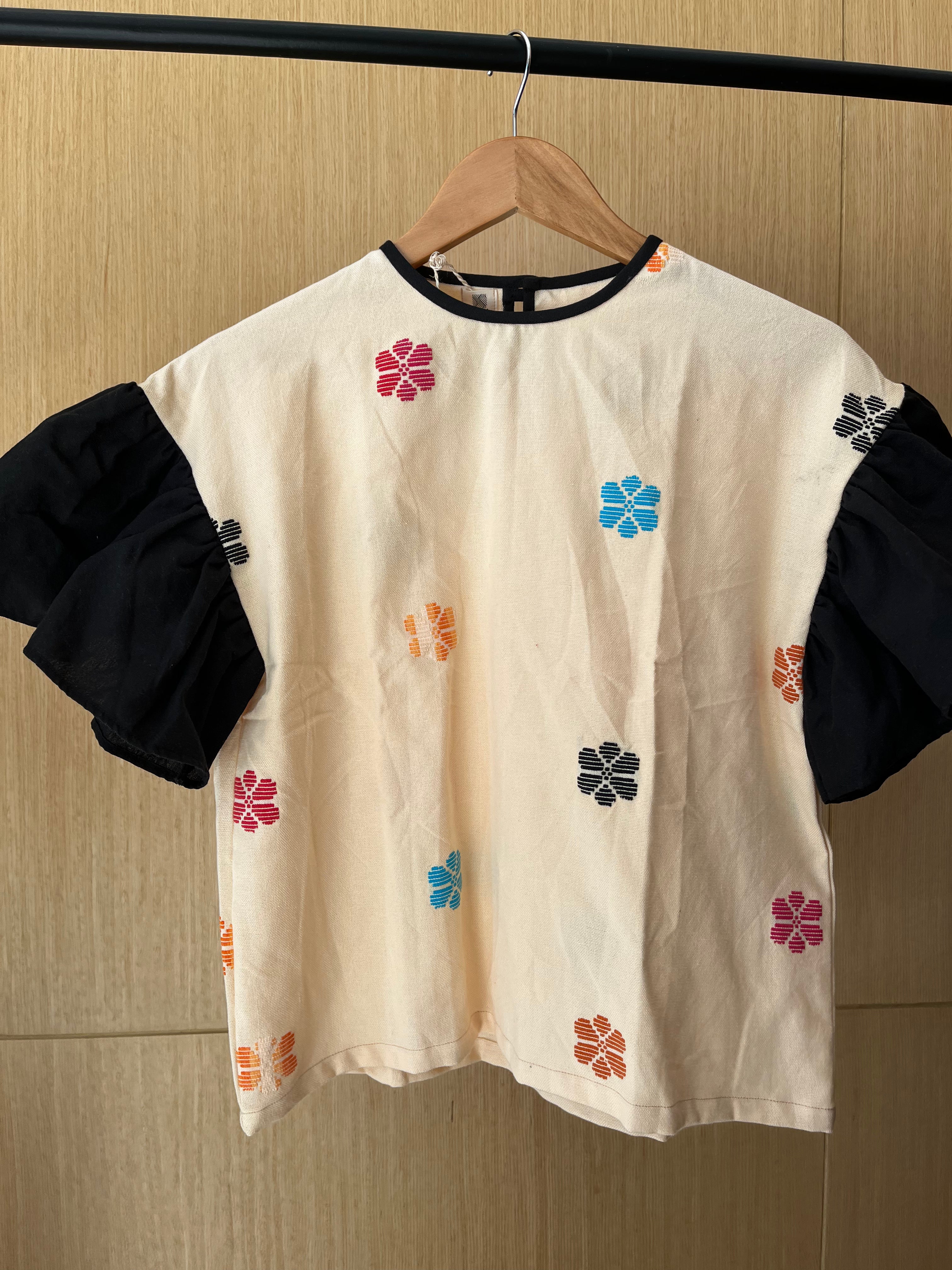 CORAZON: CREAM FLOWERS W/ BLACK SLEEVES